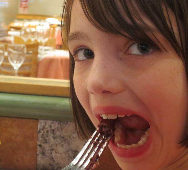 abbie eats blood sausage on a fork